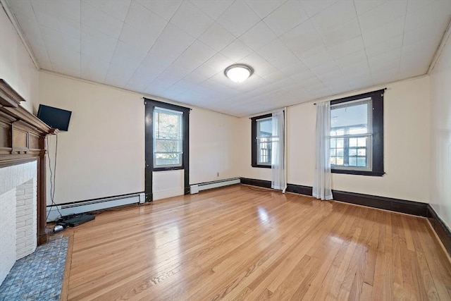 2 Hammond Ct, Quincy, MA 02169 - spare room with baseboard heating, light wood-style flooring, and a brick fireplace