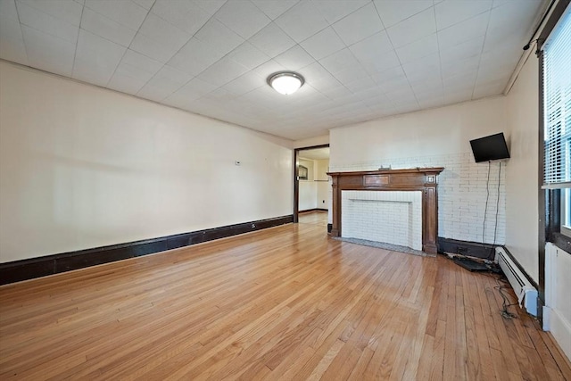2 Hammond Ct, Quincy, MA 02169 - unfurnished living room featuring baseboard heating, hardwood / wood-style flooring, and a fireplace with flush hearth