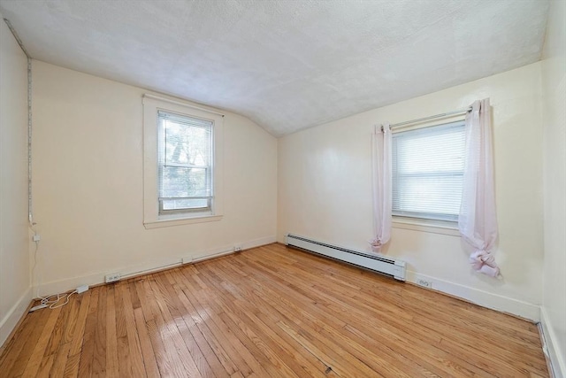 2 Hammond Ct, Quincy, MA 02169 - bonus room featuring a baseboard heating unit, lofted ceiling, light wood finished floors, and baseboards