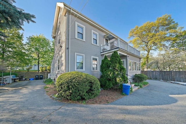2 Hammond Ct, Quincy, MA 02169 - view of side of home featuring a balcony and fence