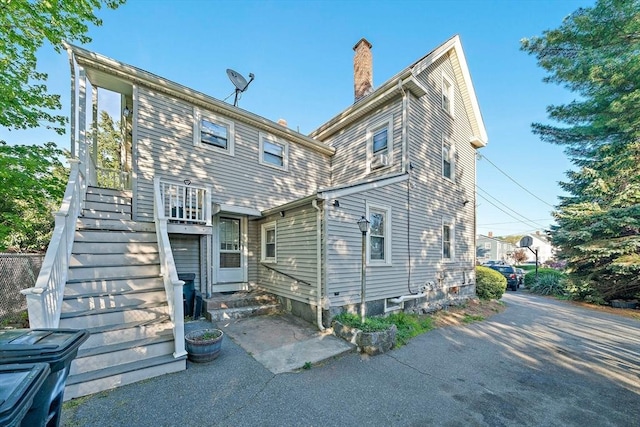 2 Hammond Ct, Quincy, MA 02169 - rear view of property with a chimney and stairs