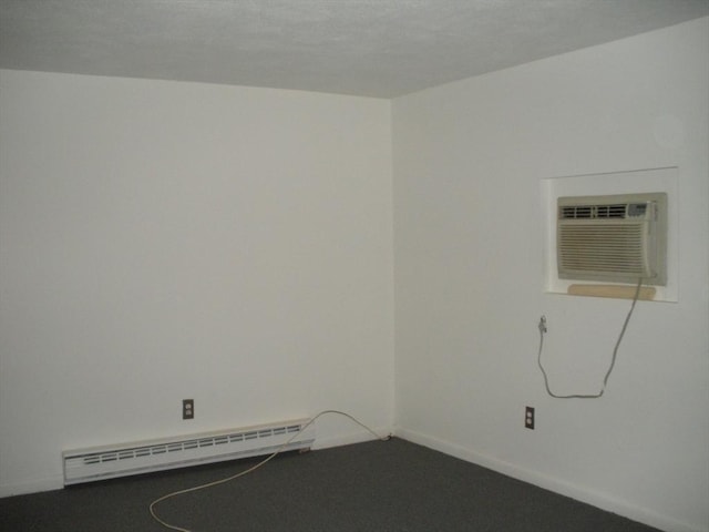 47 W St Unit A2, Randolph, MA 02368 - spare room with a baseboard heating unit, a wall unit AC, and baseboards