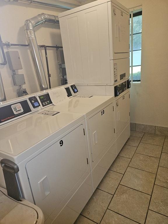 47 W St Unit A2, Randolph, MA 02368 - community laundry room featuring stacked washer / drying machine, separate washer and dryer, light tile patterned floors, and baseboards