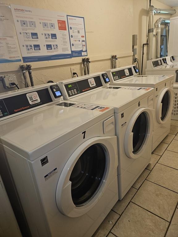 47 W St Unit A2, Randolph, MA 02368 - community laundry with independent washer and dryer and light tile patterned floors
