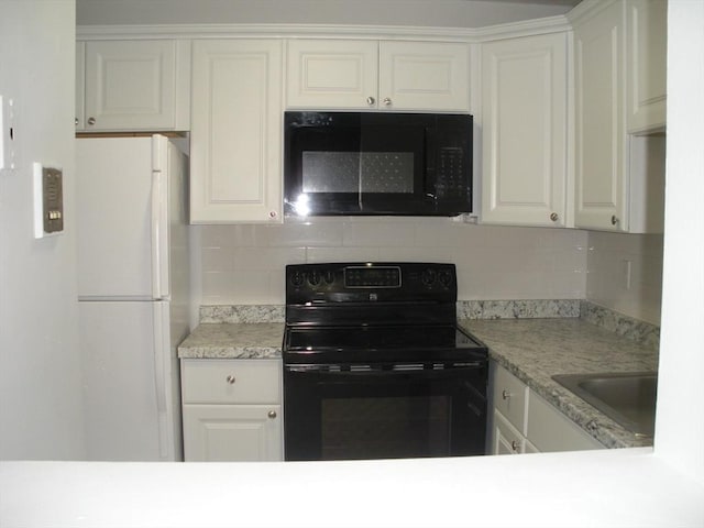 47 W St Unit A2, Randolph, MA 02368 - kitchen featuring black appliances, a sink, light countertops, and backsplash