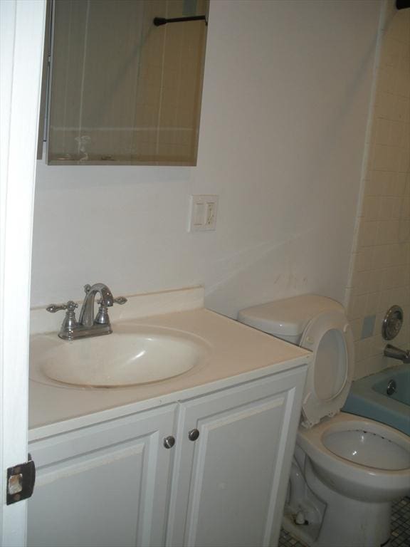 47 W St Unit A2, Randolph, MA 02368 - full bathroom with vanity, toilet, and washtub / shower combination