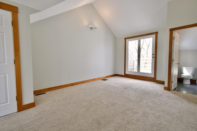 39 Bellis Cir Unit E, Cambridge, MA 02140 - unfurnished bedroom featuring visible vents, baseboards, lofted ceiling, carpet, and ensuite bath