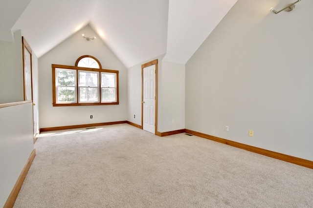 39 Bellis Cir Unit E, Cambridge, MA 02140 - bonus room with vaulted ceiling, baseboards, and carpet flooring
