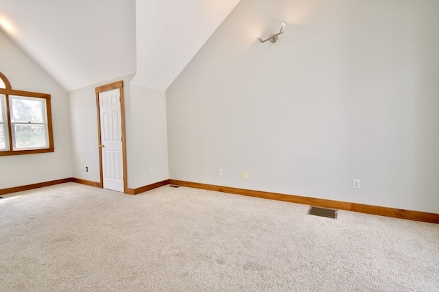 39 Bellis Cir Unit E, Cambridge, MA 02140 - additional living space with light colored carpet, baseboards, vaulted ceiling, and visible vents