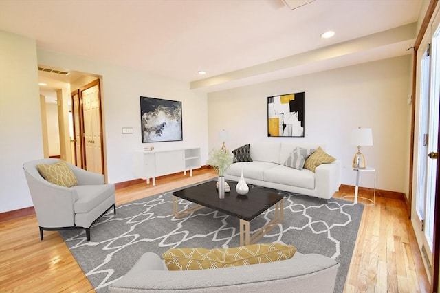 39 Bellis Cir Unit E, Cambridge, MA 02140 - living area with baseboards, wood finished floors, and visible vents