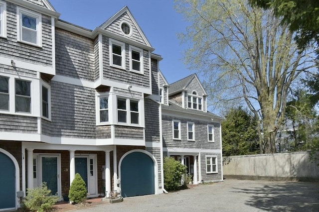 39 Bellis Cir Unit E, Cambridge, MA 02140 - shingle-style home featuring fence and driveway