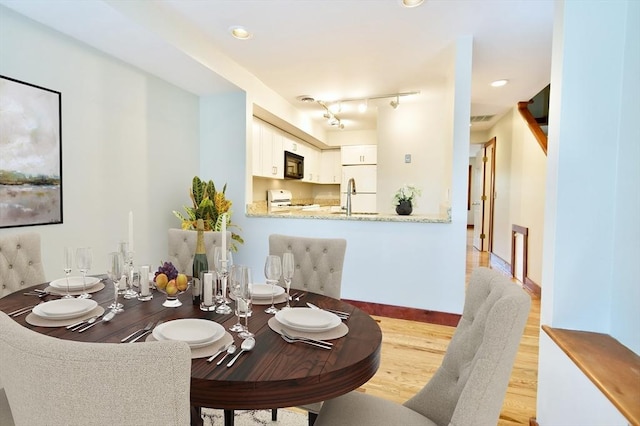 39 Bellis Cir Unit E, Cambridge, MA 02140 - dining room with light wood-type flooring and visible vents