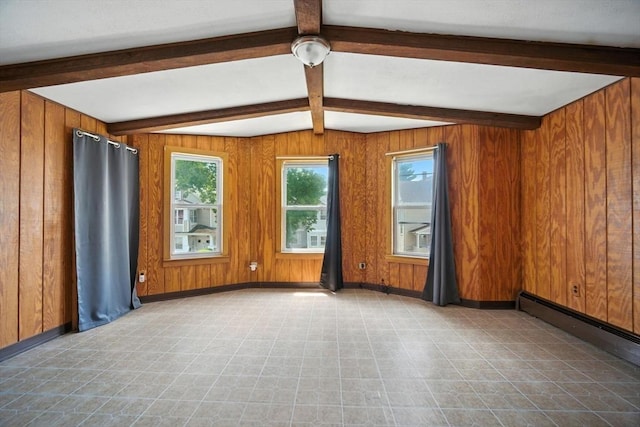 16 Laurel St, Springfield, MA 01107 - empty room featuring healthy amount of natural light, beamed ceiling, wooden walls, baseboard heating, and tile patterned floors