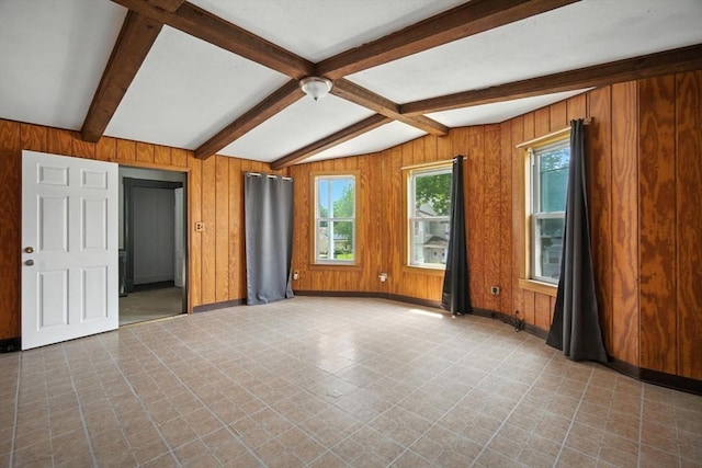 16 Laurel St, Springfield, MA 01107 - empty room featuring wooden walls and tile patterned floors