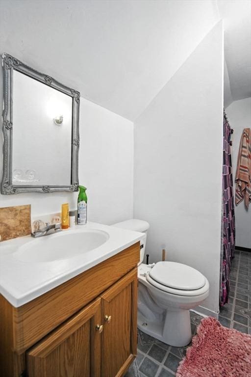 16 Laurel St, Springfield, MA 01107 - full bathroom with vaulted ceiling, vanity, tile patterned flooring, and a shower with shower curtain