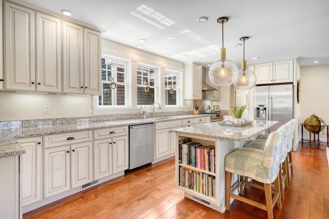27 Watcha Path, Edgartown, MA 02539 - kitchen featuring premium appliances, light wood-style flooring, a kitchen island, hanging light fixtures, and recessed lighting