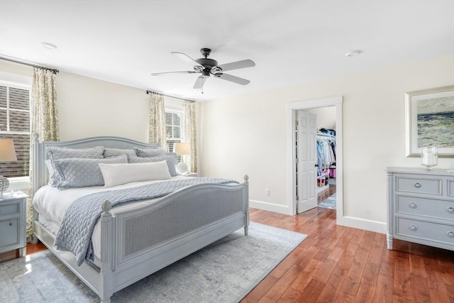 27 Watcha Path, Edgartown, MA 02539 - bedroom featuring wood finished floors, a walk in closet, a ceiling fan, and a closet