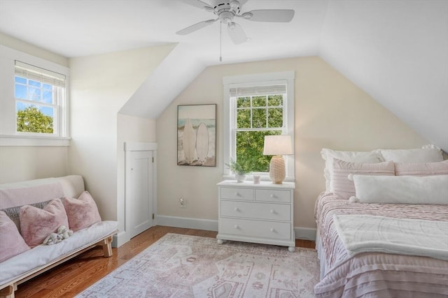 27 Watcha Path, Edgartown, MA 02539 - bedroom with multiple windows, vaulted ceiling, light wood-style floors, and a ceiling fan