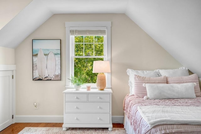 27 Watcha Path, Edgartown, MA 02539 - bedroom with lofted ceiling and light wood-type flooring