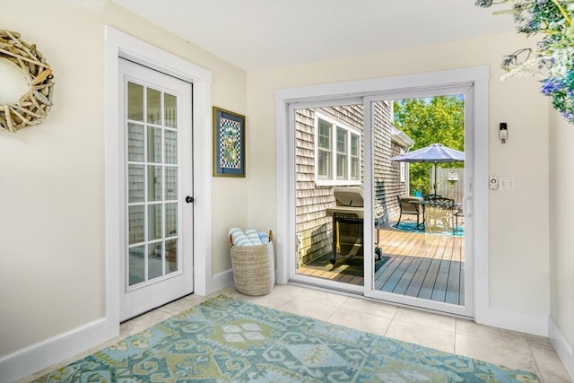 27 Watcha Path, Edgartown, MA 02539 - doorway to outside featuring tile patterned floors and baseboards