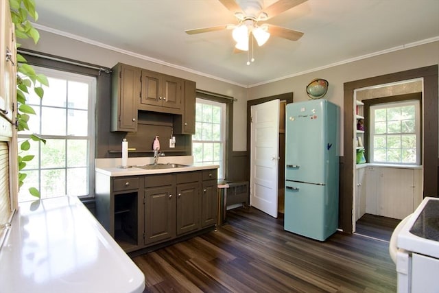 31 E St, Stafford, CT 06076 - kitchen featuring range, freestanding refrigerator, dark wood finished floors, ceiling fan, and light countertops