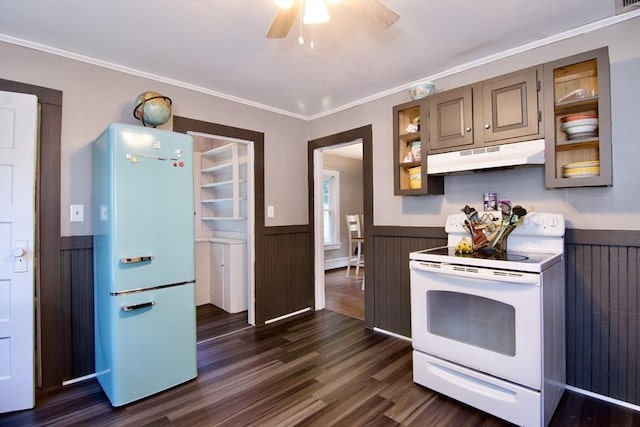 31 E St, Stafford, CT 06076 - kitchen featuring white electric stove, freestanding refrigerator, under cabinet range hood, wainscoting, and dark wood-style flooring