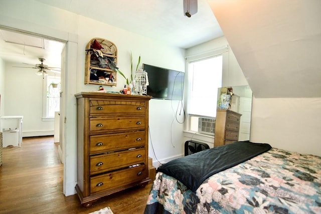 31 E St, Stafford, CT 06076 - bedroom with multiple windows, baseboard heating, wood finished floors, and attic access