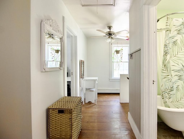 31 E St, Stafford, CT 06076 - hallway with a baseboard radiator, attic access, and dark wood finished floors