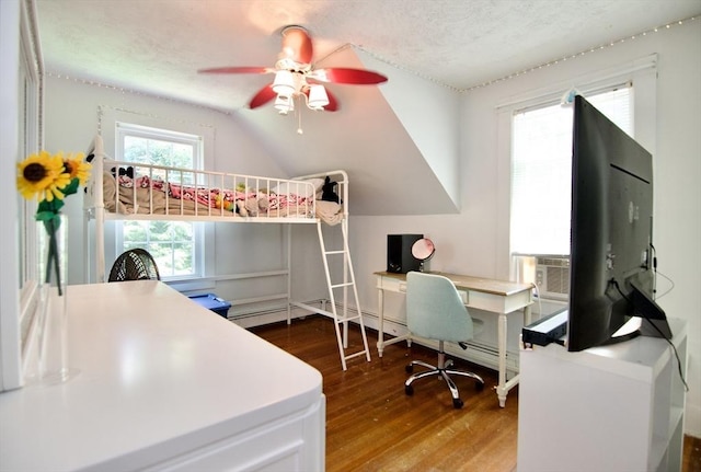 31 E St, Stafford, CT 06076 - bedroom featuring wood finished floors, an office area, lofted ceiling, a textured ceiling, and a ceiling fan