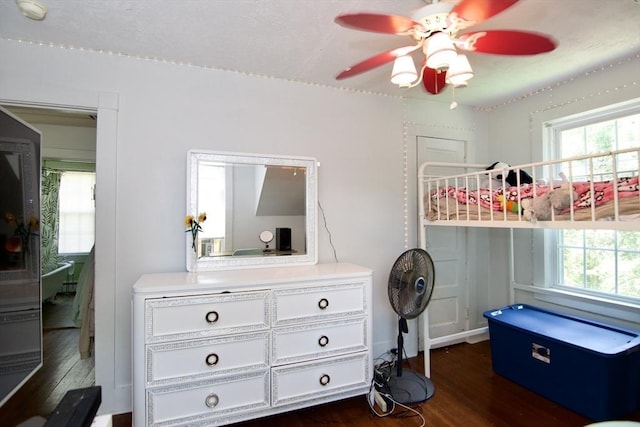 31 E St, Stafford, CT 06076 - bedroom featuring dark wood finished floors, multiple windows, and a ceiling fan