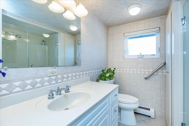 113 N Ridge Rd, Ipswich, MA 01938 - bathroom with a baseboard radiator, tile walls, a stall shower, vanity, and toilet