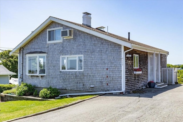 113 N Ridge Rd, Ipswich, MA 01938 - view of home's exterior featuring a chimney