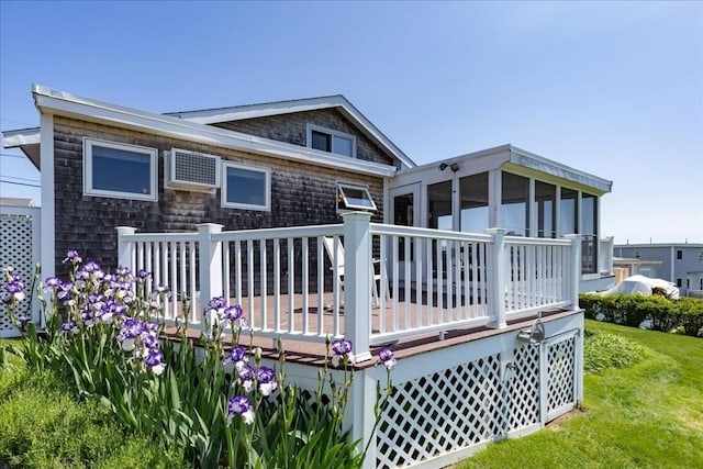 113 N Ridge Rd, Ipswich, MA 01938 - rear view of property featuring a deck, a yard, and a sunroom