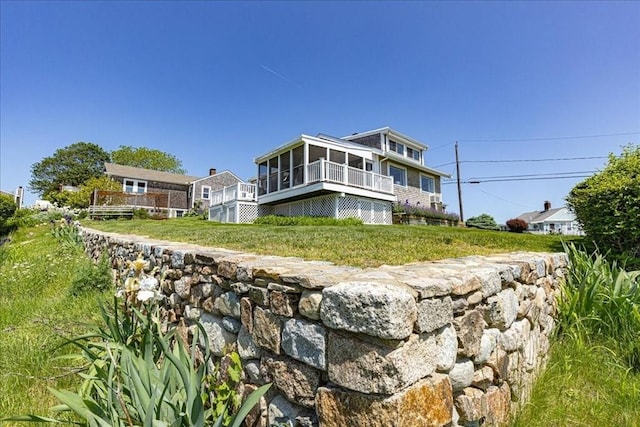 113 N Ridge Rd, Ipswich, MA 01938 - back of property with a sunroom and a wooden deck