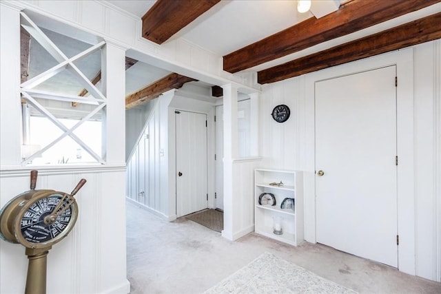 113 N Ridge Rd, Ipswich, MA 01938 - hallway with light carpet, beam ceiling, and a decorative wall