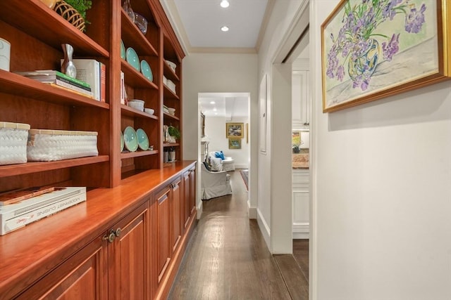 hall with crown molding, recessed lighting, and dark wood-style flooring