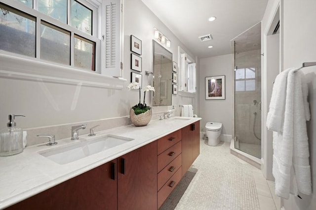 full bathroom featuring tile patterned flooring, visible vents, toilet, a stall shower, and a sink