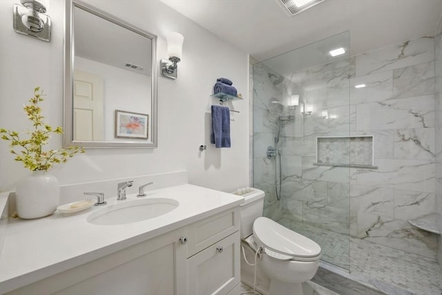 full bathroom with vanity, toilet, visible vents, and a marble finish shower