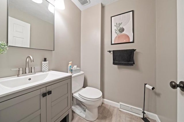 547 Washington St Unit B13, Pembroke, MA 02359 - half bathroom featuring wood finished floors and vanity