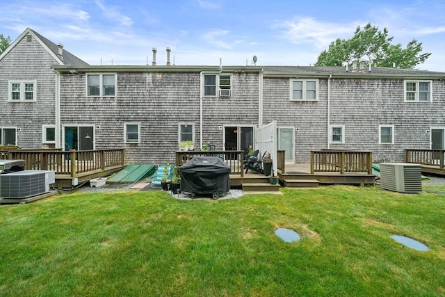 547 Washington St Unit B13, Pembroke, MA 02359 - rear view of house featuring a wooden deck and a lawn