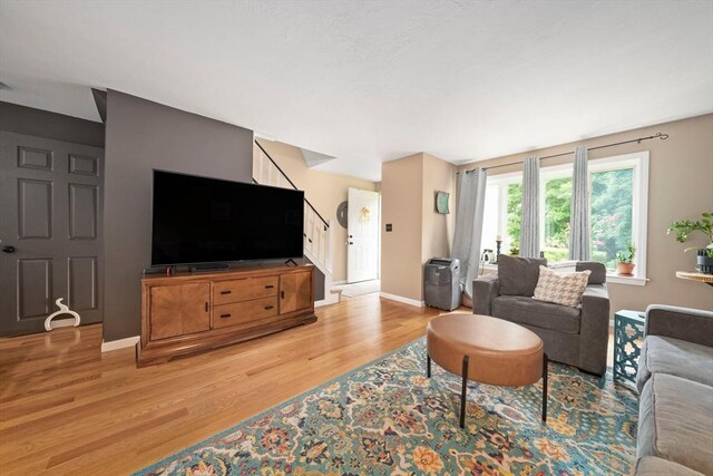 547 Washington St Unit B13, Pembroke, MA 02359 - living room featuring stairs and wood finished floors
