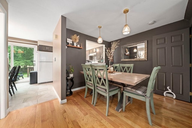 547 Washington St Unit B13, Pembroke, MA 02359 - dining space with a chandelier and light wood-style floors