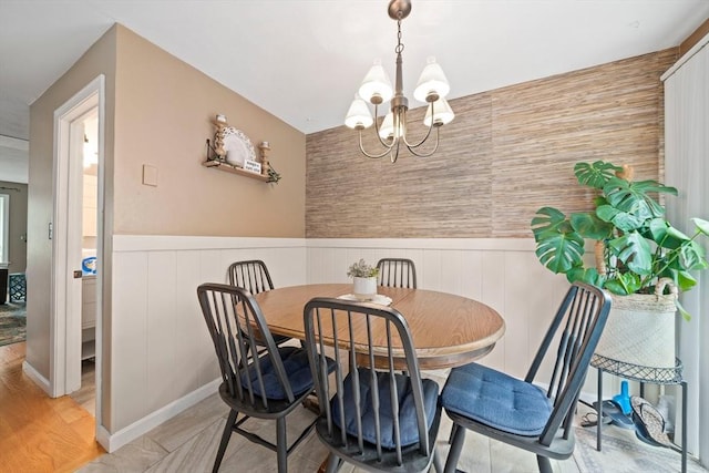 547 Washington St Unit B13, Pembroke, MA 02359 - dining area featuring a chandelier and wainscoting