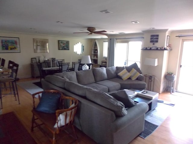 154 Lynnway Unit 309, Lynn, MA 01902 - living area featuring light wood-style flooring, a ceiling fan, and ornamental molding