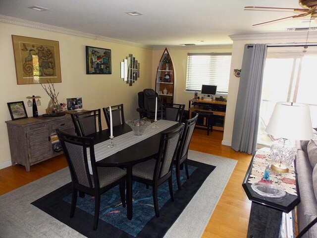 154 Lynnway Unit 309, Lynn, MA 01902 - dining area featuring light wood-type flooring, crown molding, and ceiling fan