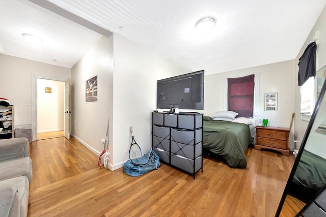 bedroom with hardwood / wood-style floors