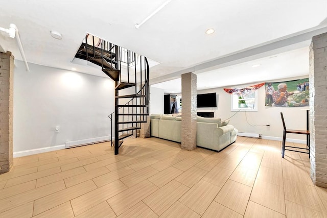 living room with a baseboard heating unit