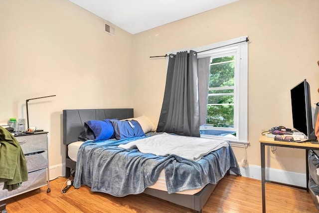 bedroom with light hardwood / wood-style flooring