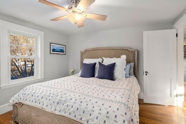 bedroom featuring hardwood / wood-style flooring and ceiling fan