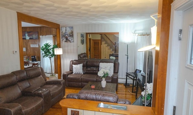 82 Jefferson Ave, Everett, MA 02149 - living room with a baseboard radiator, wood finished floors, and stairway